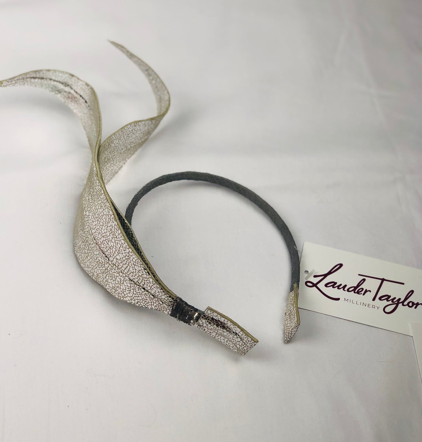 Millinery | Silver leather feather
