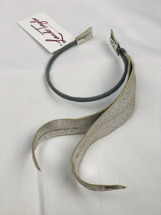 Millinery | Silver leather feather