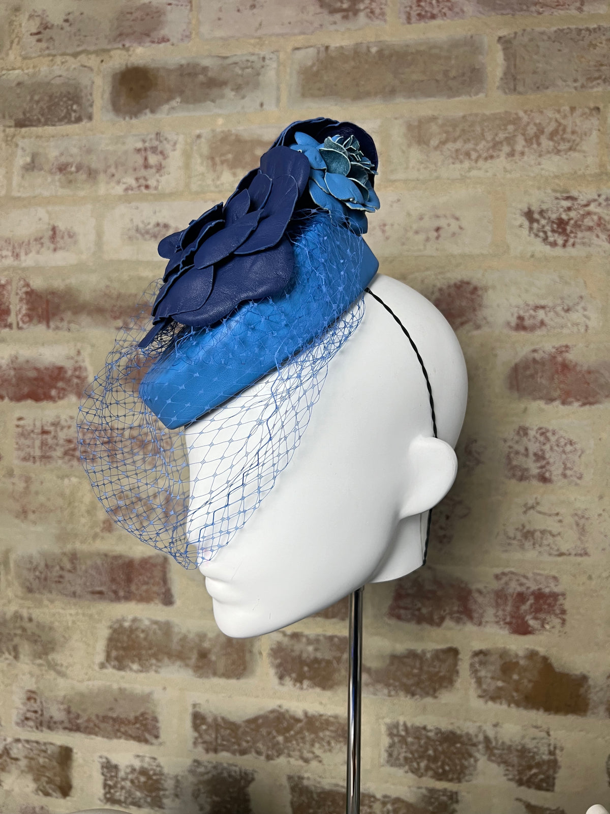 Millinery | Blue leather button