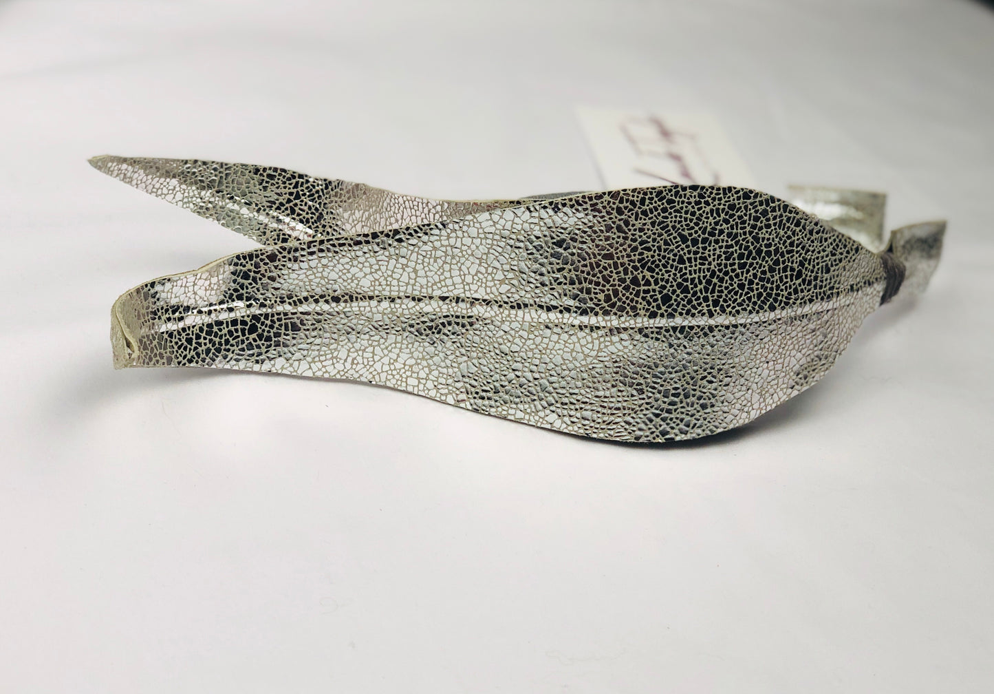 Millinery | Silver leather feather